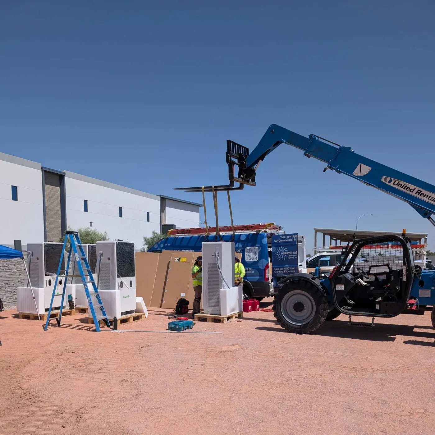 Autel DC fast chargers staged on site during an Evolved install