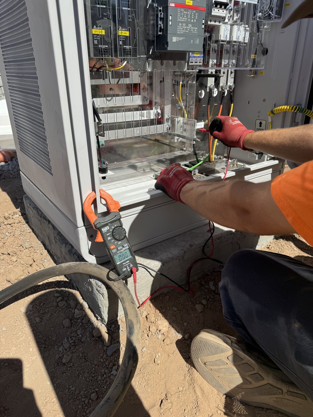 Evolved technician testing a charger's electrical system during service
