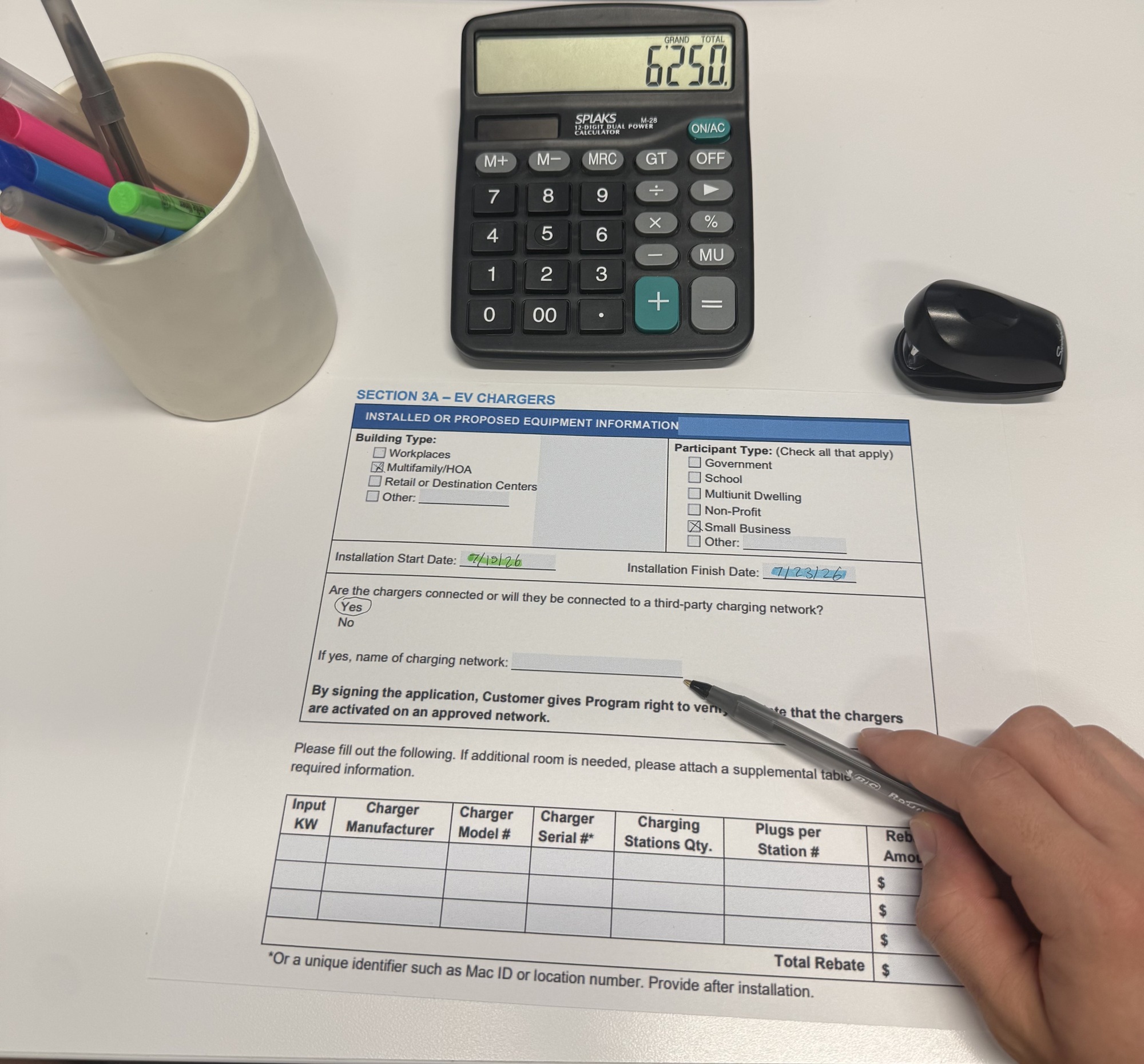 Filling out an EV charger rebate application — Evolved handles the utility paperwork
