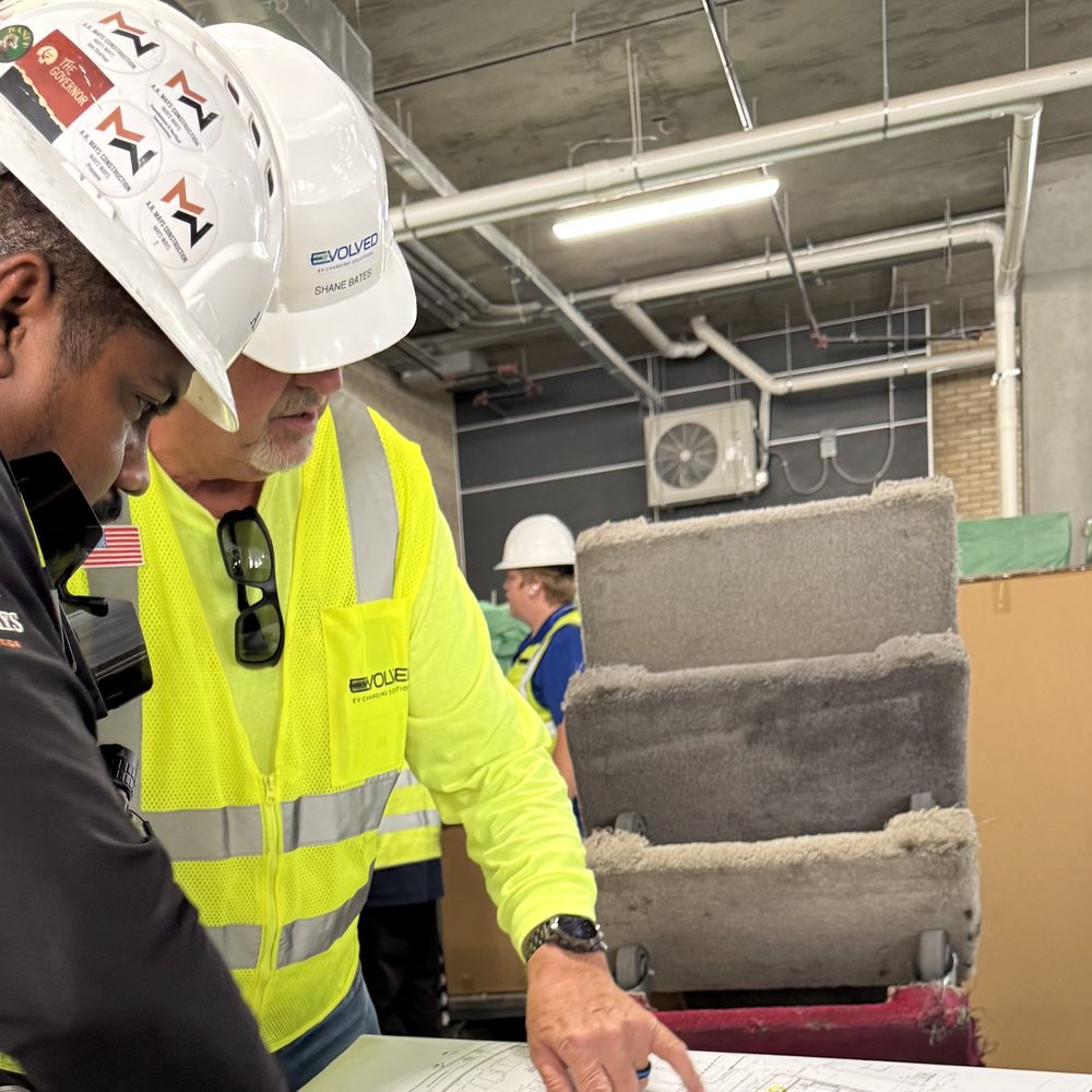 Evolved crew reviewing site plans on the jobsite