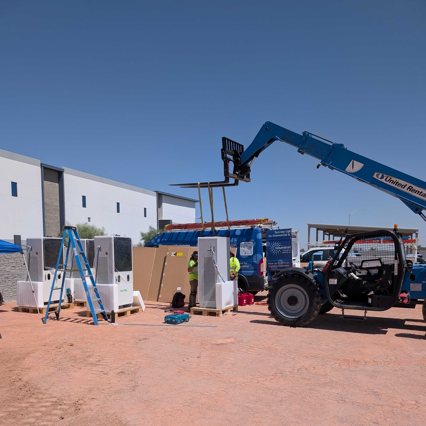 Autel DC fast chargers staged on site during an Evolved install