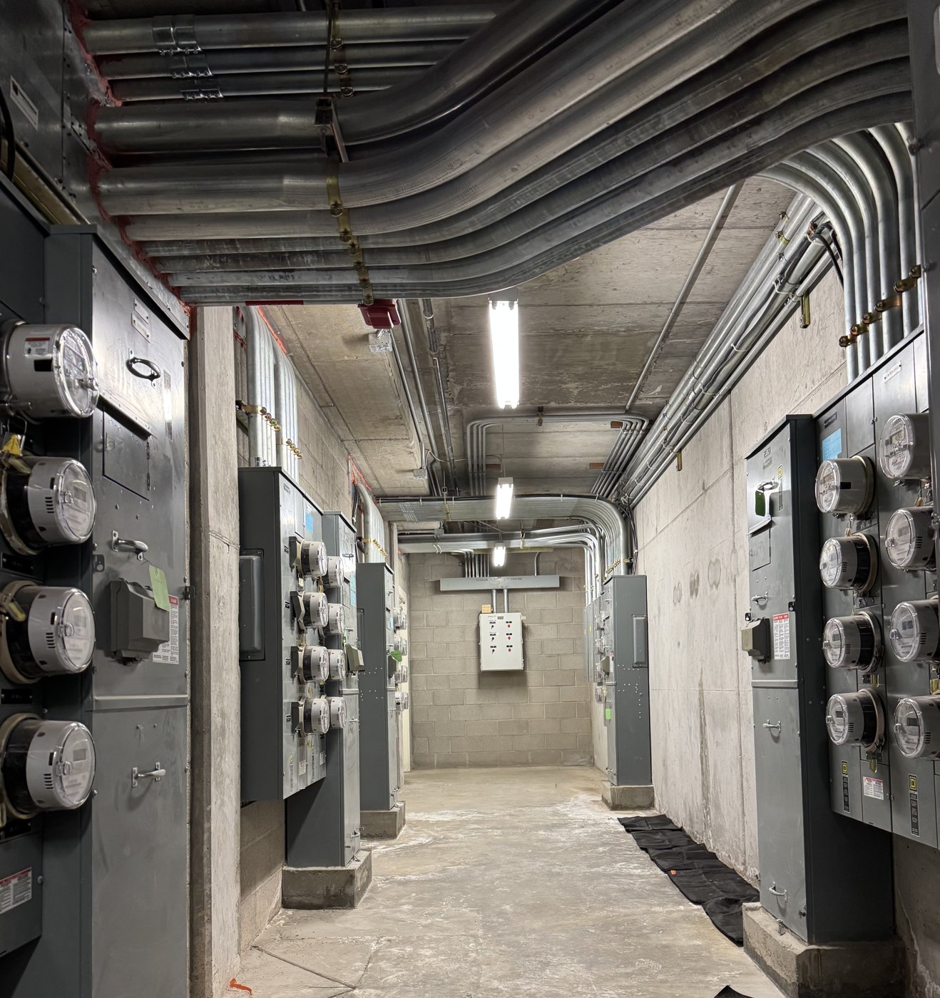 Evolved evaluating an existing electrical room during a site walk